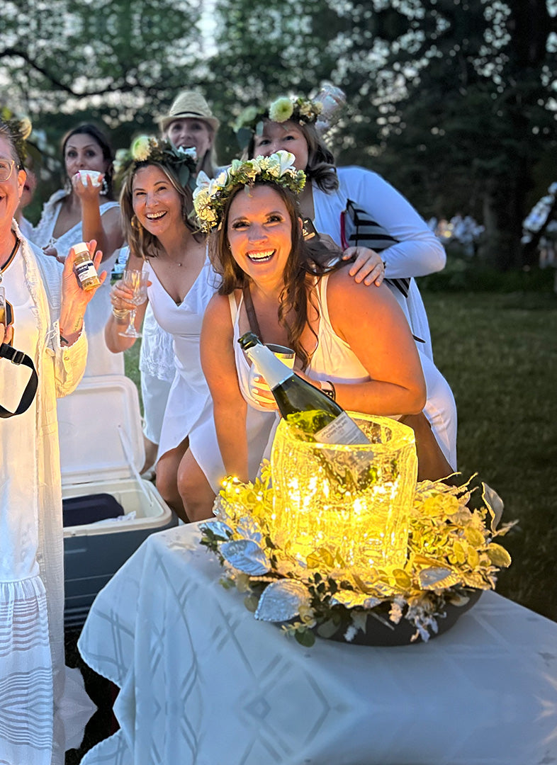 A group of summertime merrymakers enjoyed the novelty of a fluted ice lantern used to chill champagne!