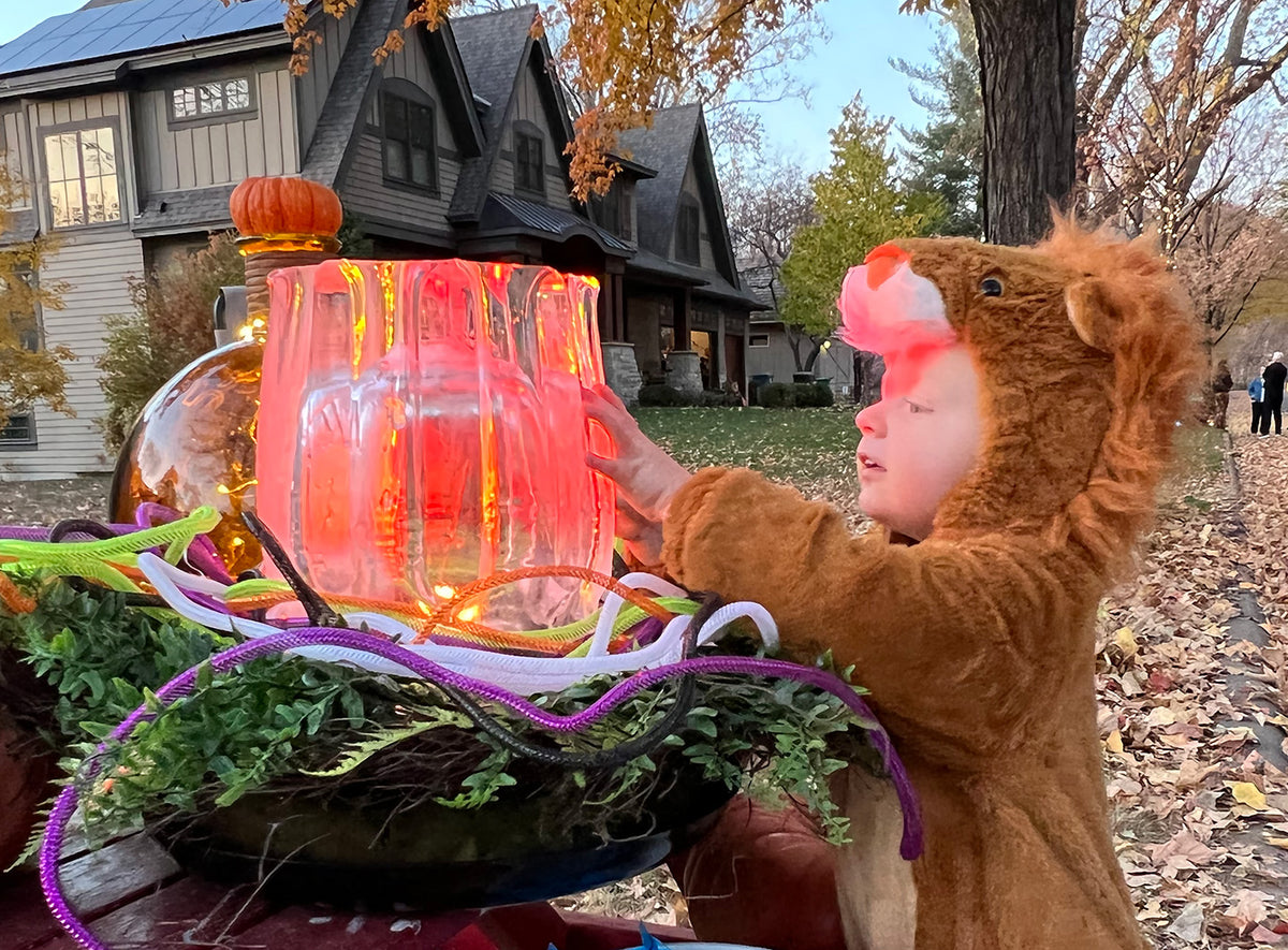 This fluted ice lantern lit with an LED light set on red intrigued a young trick or treater.